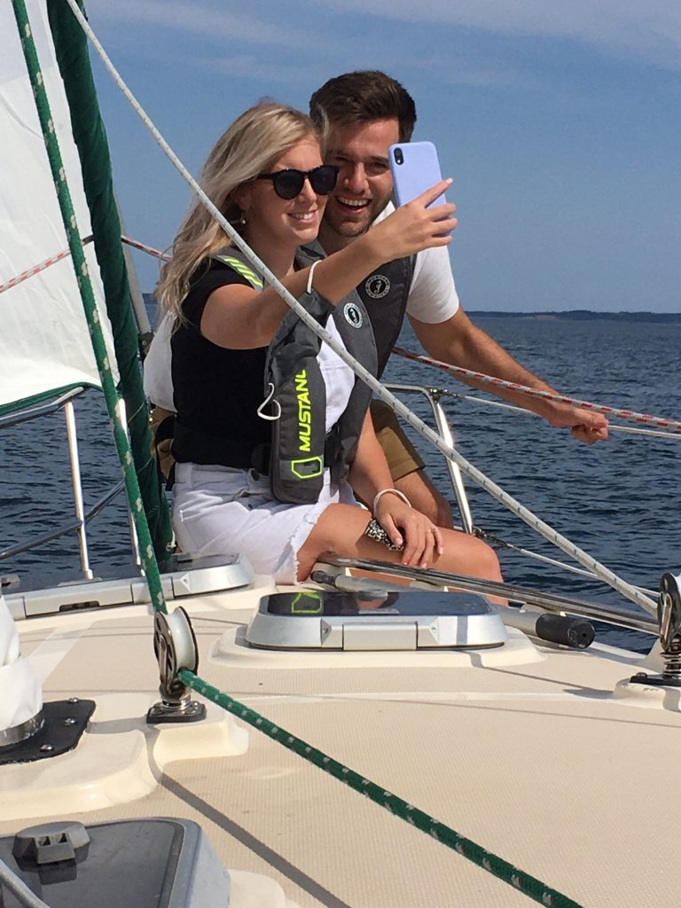 Guests on Sail Tours in Nova Scotia take a selfie on the Bow