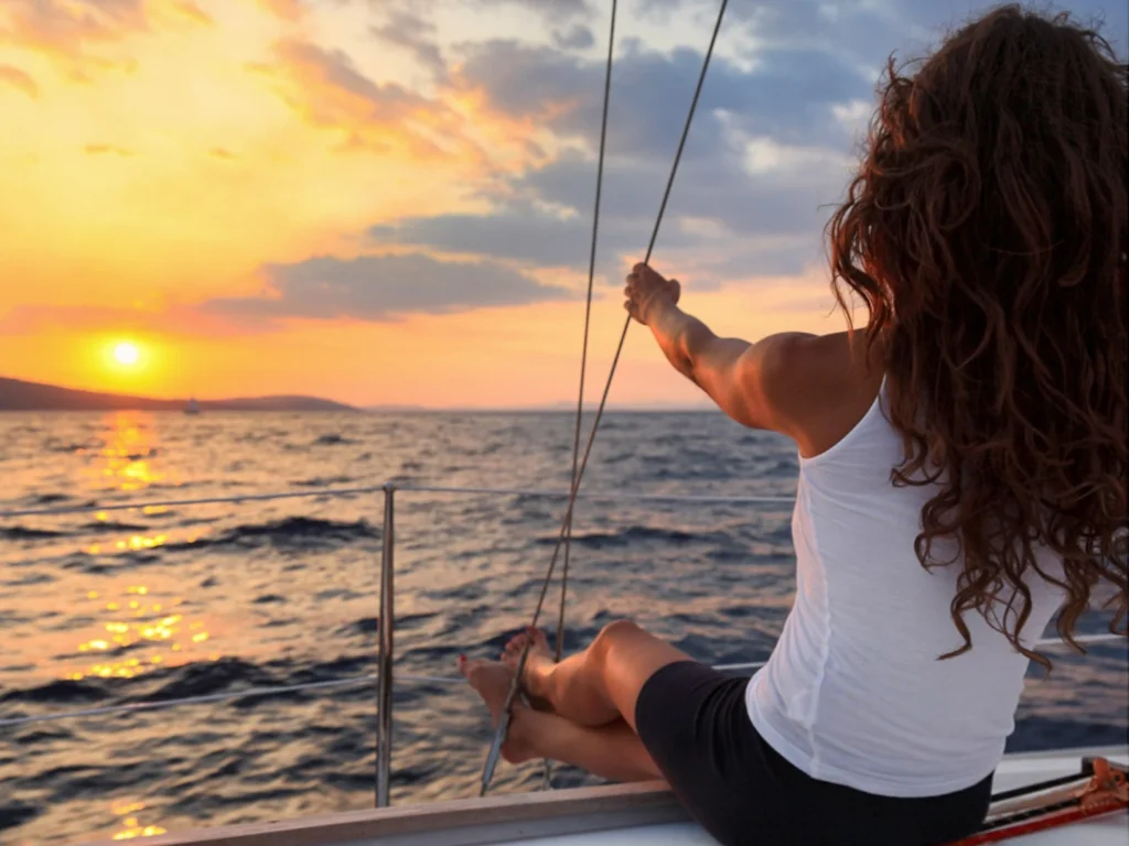 Woman watching the sunset on a Sailing Tour in Nova Scotia