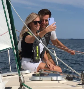 Guests on Sail Tours in Nova Scotia take a selfie on the Bow